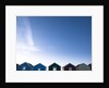 Beach huts in a row against blue skies by Assaf Frank